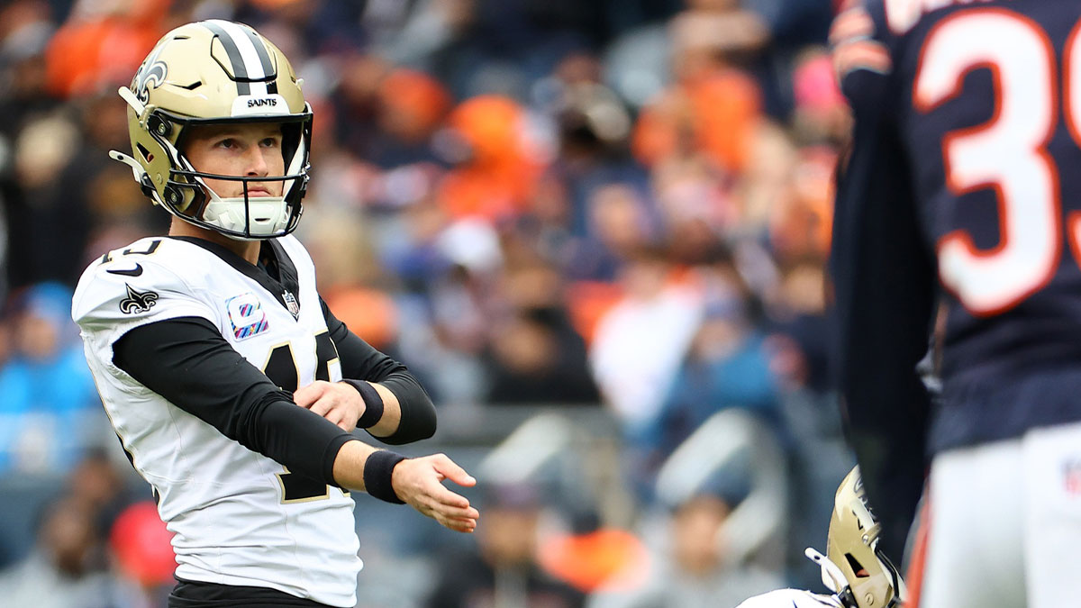 New Orleans Saints kicker Blake Grupe (19) gets set kick a PAT against the Chicago Bears during the second half at Soldier Field.