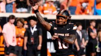 Oklahoma State Cowboys quarterback Sam Jackson V (18) warms up before a college football game between the Oklahoma State Cowboys (OSU) and the Houston Cougars at Boone Pickens Stadium in Stillwater, Okla.