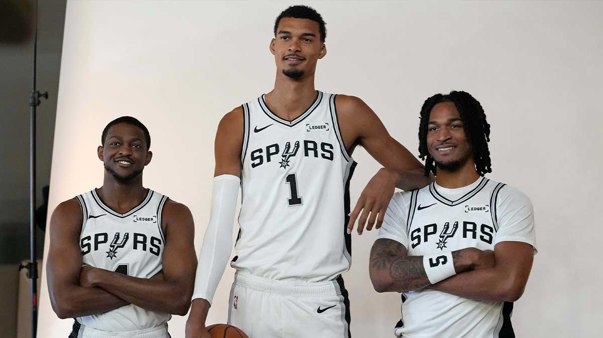 San Antonio Spurs forward-center Victor Wembanyama (1) along with guards De’Aaron Fox (4) and Stephon Castle (5) pose for photos during Media Day at Victory Capital Performance Center in San Antonio.