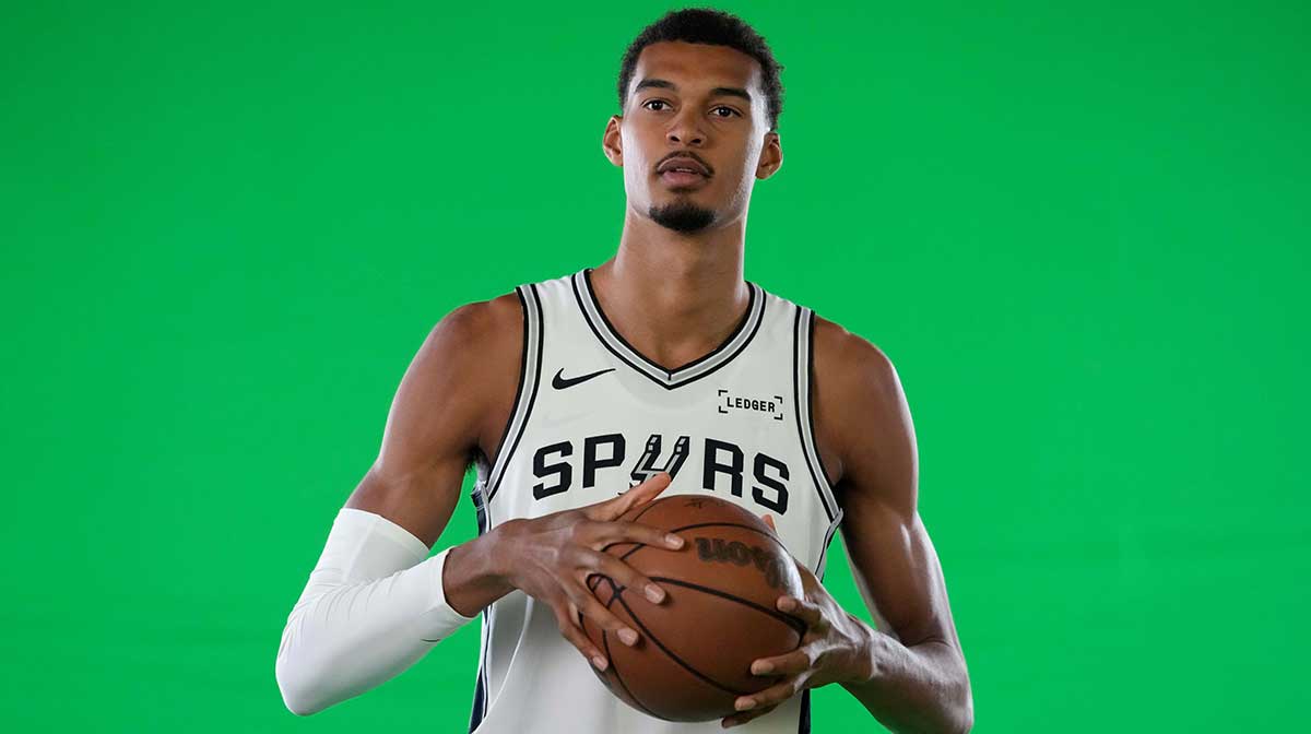 San Antonio Spurs forward-center Victor Wembanyama (1) poses for photos during Media Day at Victory Capital Performance Center in San Antonio