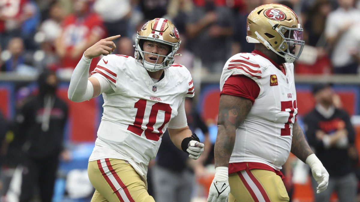 San Francisco 49ers quarterback Mac Jones (10) motions after a play