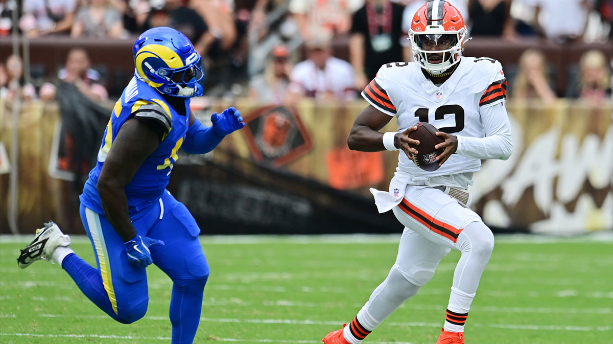 Los Angeles Rams linebacker Jamil Muhammad (45) chases Cleveland Browns quarterback Shedeur Sanders (12) during the second half at Huntington Bank Field.