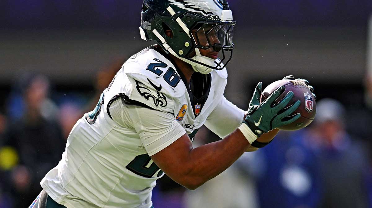 Philadelphia Eagles running back Saquon Barkley (26) controls the ball during the second half against the Minnesota Vikings at U.S. Bank Stadium.