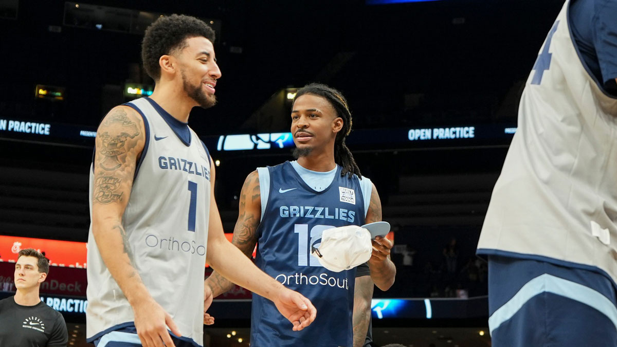 Grizzlies' Scotty Pippen Jr. (1) and Ja Morant (12) talk and laugh together during open practice at the FedExForum on October 4, 2025, in Memphis, Tenn.
