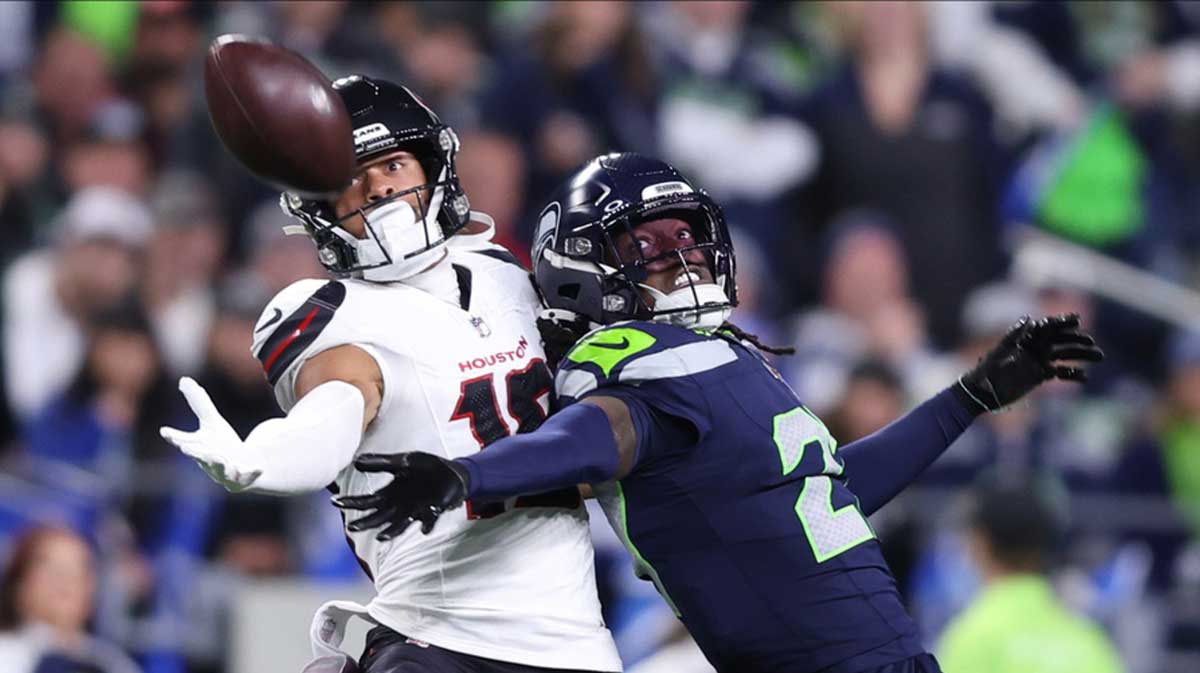 Seattle Seahawks cornerback Riq Woolen (27) defends a pass intended for Houston Texans wide receiver Xavier Hutchinson (19) during the fourth quarter at Lumen Field