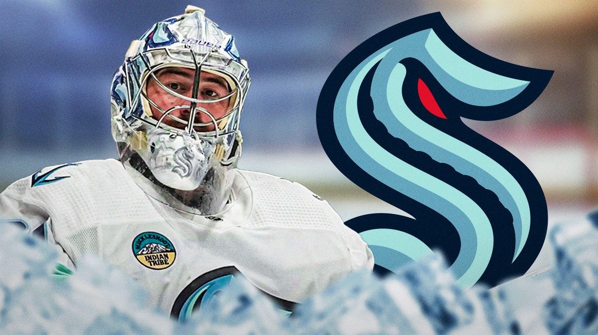 Phillip Grubauer on the left, Kraken logo in the background.
