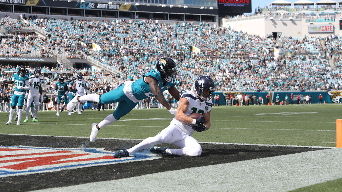 Seattle Seahawks wide receiver Cooper Kupp (10) scores a touchdown during the second half against Jacksonville Jaguars cornerback Jourdan Lewis (2) at EverBank Stadium.