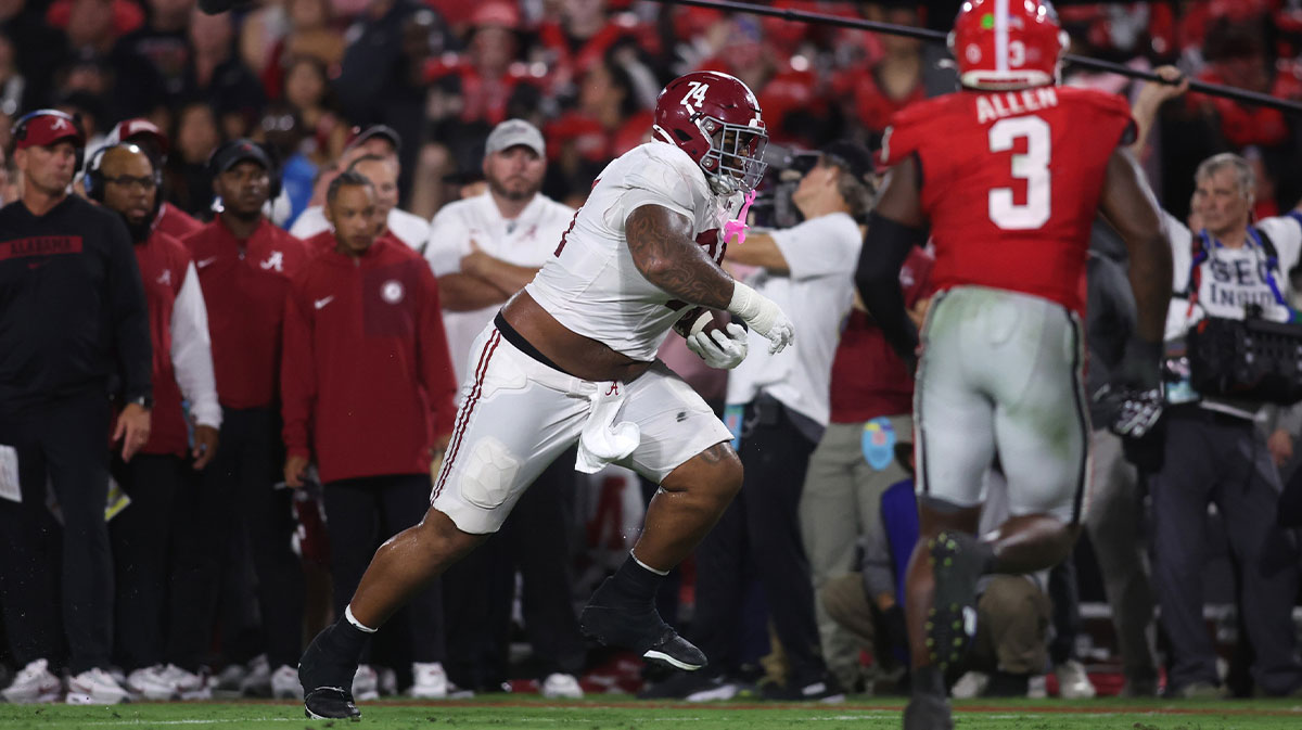 Alabama Crimson Tide offensive lineman Kadyn Proctor (74) runs against the Georgia Bulldogs in the second quarter at Sanford Stadium.