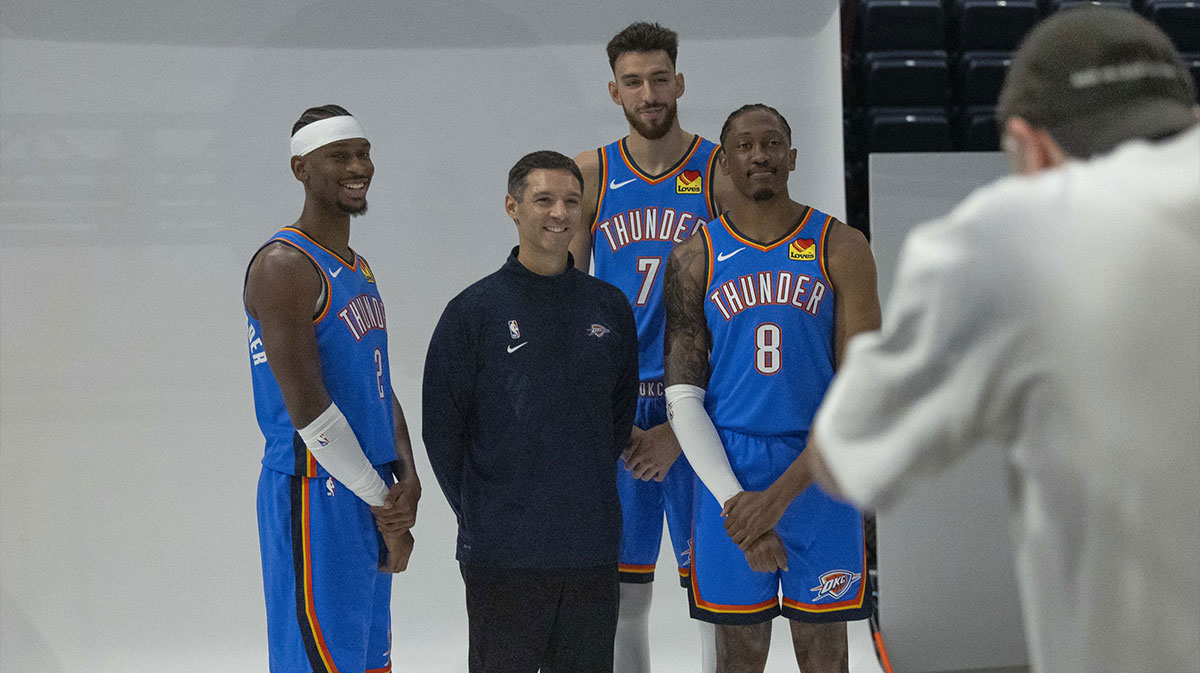 Oklahoma City Thunder guard Shai Gilgeous-Alexander (2), head coach Mark Daigneault, forward Chet Holmgren (7) and forward Jalen Williams (8) poses for a photo during the 2025 Oklahoma City Thunder media day at Paycom Center.