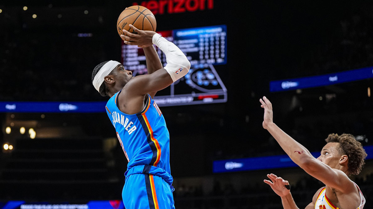 Oklahoma City Thunder guard Shai Gilgeous-Alexander (2) shoots over Atlanta Hawks guard Dyson Daniels (5) during the second half at State Farm Arena.