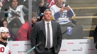 New Jersey Devils head coach Sheldon Keefe (center) stands behind the bench before the start of the third period against the San Jose Sharks at SAP Center at San Jose.