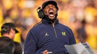 Michigan head coach Sherrone Moore cheers on before a play against Washington during the first half at Michigan Stadium in Ann Arbor on Saturday, Oct. 18, 2025.