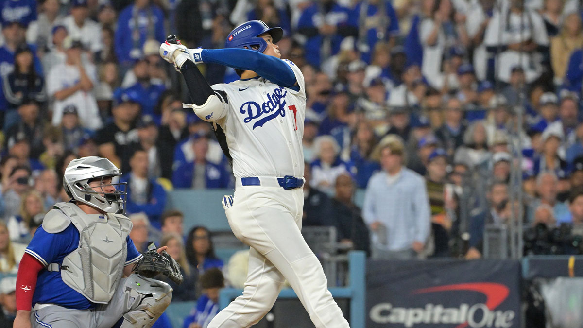 Los Angeles Dodgers two-way player Shohei Ohtani (17) hits a solo home run against the Toronto Blue Jays in the seventh inning during game three of the 2025 MLB World Series at Dodger Stadium.