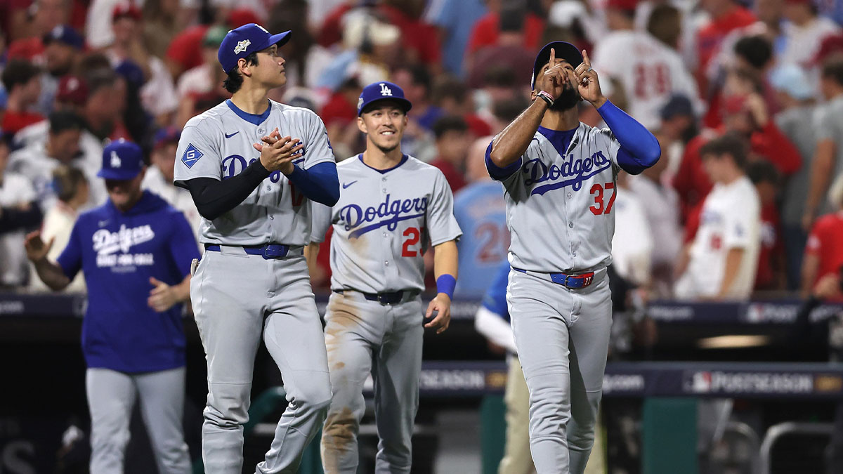 Los Angeles Dodgers two-way player Shohei Ohtani (17) and second baseman Tommy Edman (25) and right fielder Teoscar Hernandez (37) celebrate after defeating the Philadelphia Phillies in game one of the NLDS round for the 2025 MLB playoffs at Citizens Bank Park.