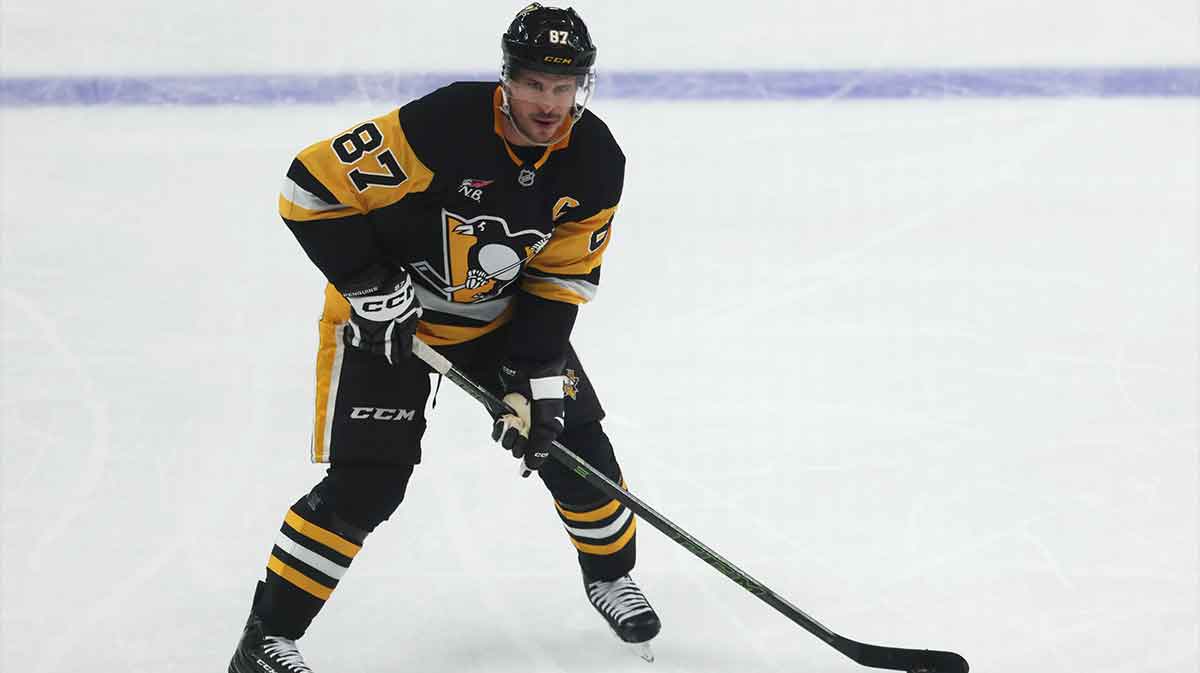 Pittsburgh Penguins center Sidney Crosby (87) skates with the puck against the Columbus Blue Jackets during the second period at PPG Paints Arena.