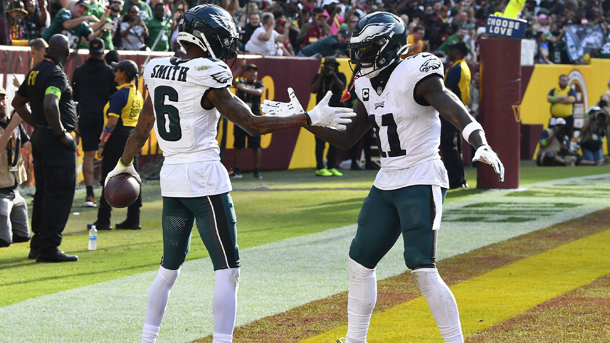 Philadelphia Eagles wide receiver DeVonta Smith (6) celebrates with wide receiver A.J. Brown (11) after scoring a touchdown against Washington Commanders during the second half at FedExField.