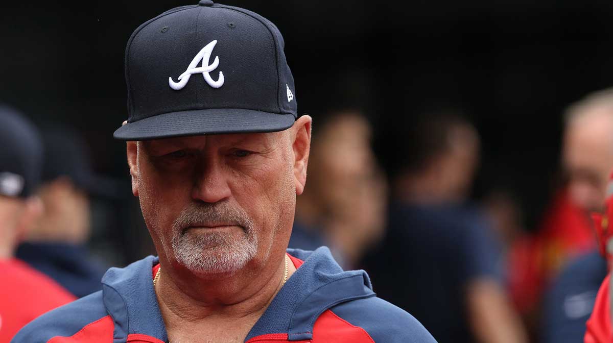 Atlanta Braves manager Brian Snitker stands in the Braves' dugout prior to the game against the Washington Nationals at Nationals Park.