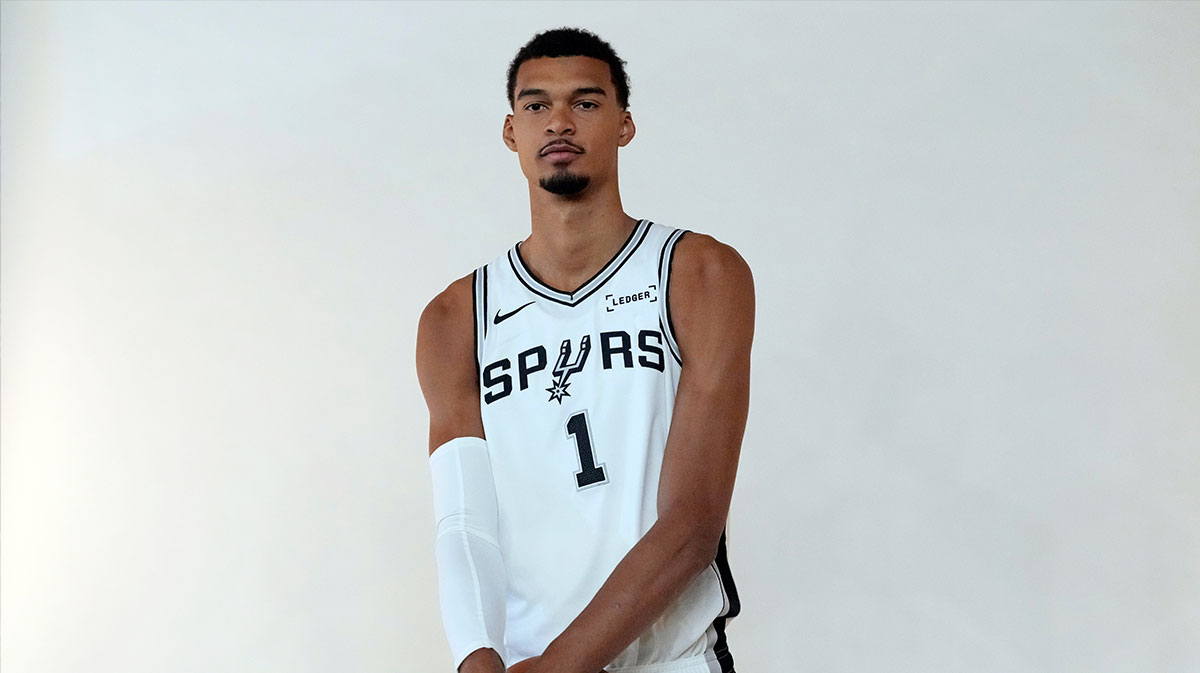 San Antonio Spurs forward-center Victor Wembanyama (1) poses for photos during Media Day at Victory Capital Performance Center in San Antonio.