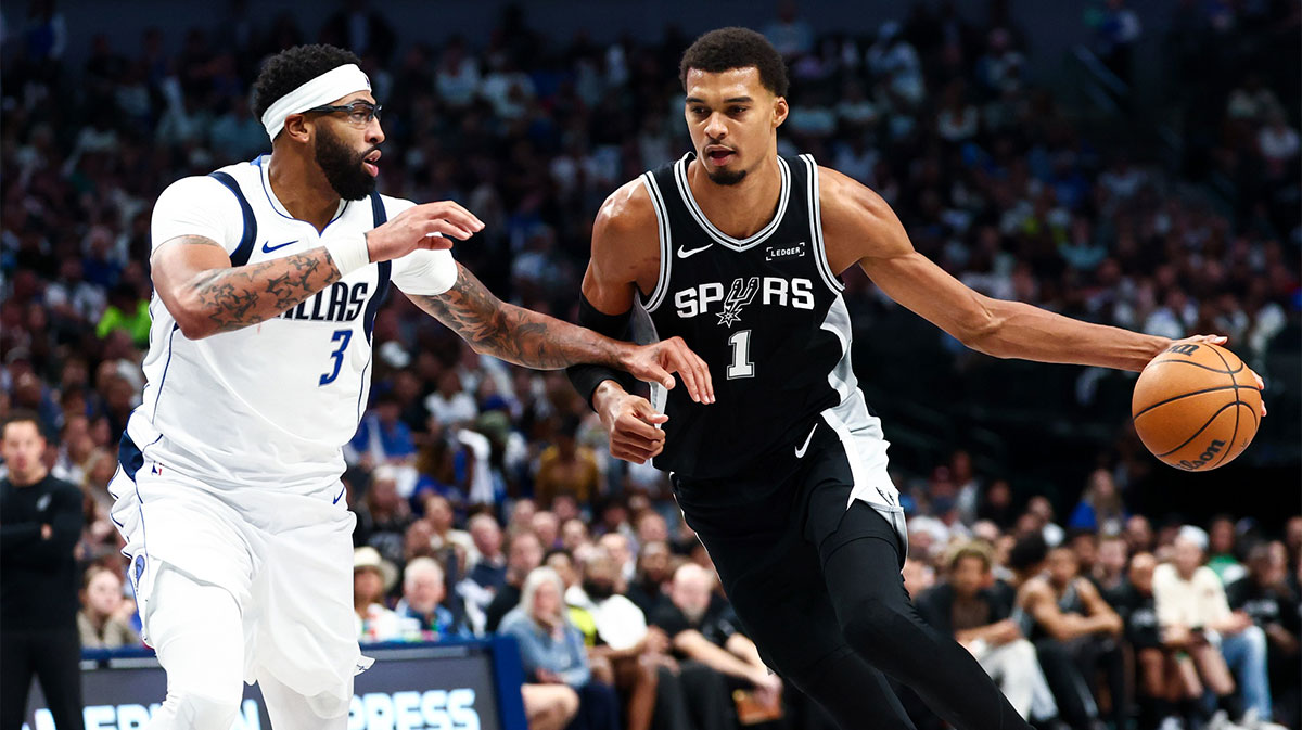 San Antonio Spurs forward Victor Wembanyama (1) drives to the basket as Dallas Mavericks forward Anthony Davis (3) defends during the second half at American Airlines Center.