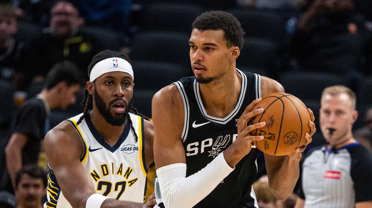 San Antonio Spurs forward/center Victor Wembanyama (1) holds the ball while Indiana Pacers forward Isaiah Jackson (22) defends in the first half at Gainbridge Fieldhouse.