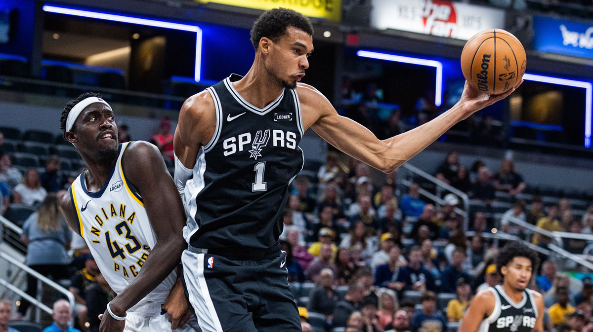 Spurs forward/center Victor Wembanyama (1) rebounds the ball while Indiana Pacers forward Pascal Siakam (43) defends in the first half at Gainbridge Fieldhouse