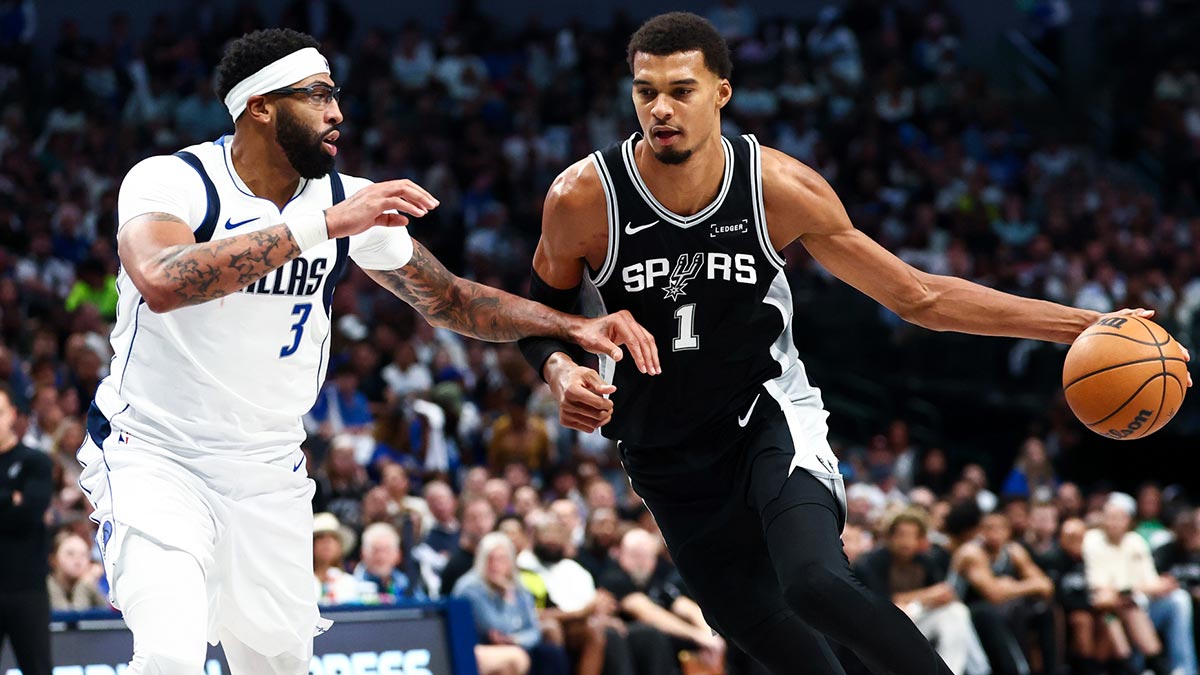 San Antonio Spurs forward Victor Wembanyama (1) drives to the basket as Dallas Mavericks forward Anthony Davis (3) defends during the second half at American Airlines Center.