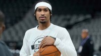 San Antonio Spurs guard Dylan Harper (2) warms up before a game against the Guangzhou Loong Lions at Frost Bank Center.