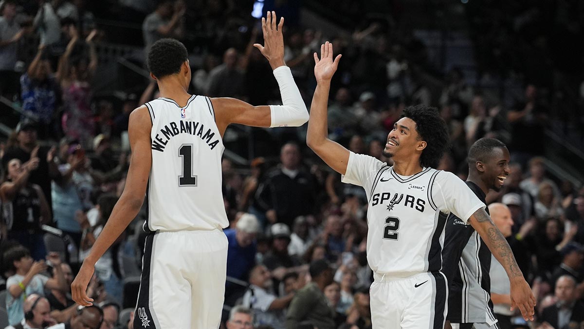 Spurs forward Victor Wembanyama (1) and guard Dylan Harper (2) celebrates in the second half against the Brooklyn Nets at Frost Bank Center