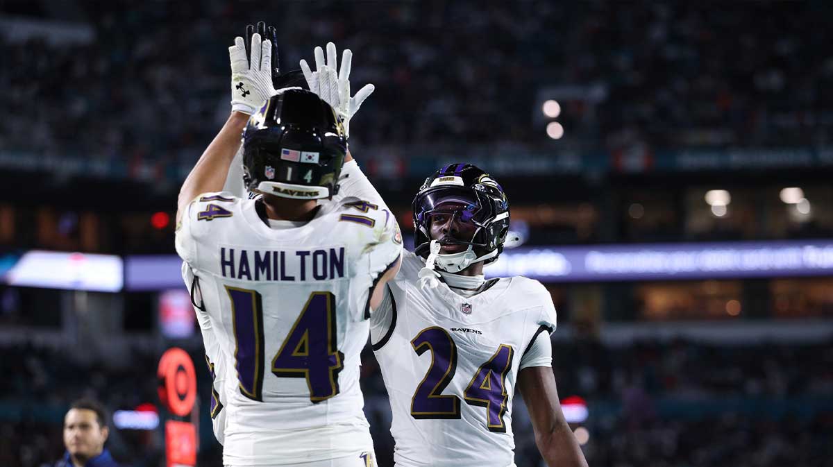 Baltimore Ravens safety Kyle Hamilton (14) and safety Malaki Starks (24) react after a play during the second quarter against the Miami Dolphins at Hard Rock Stadium.