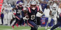 New England Patriots wide receiver Stefon Diggs gets about 10 yards on the play after catching a pass during second half action.