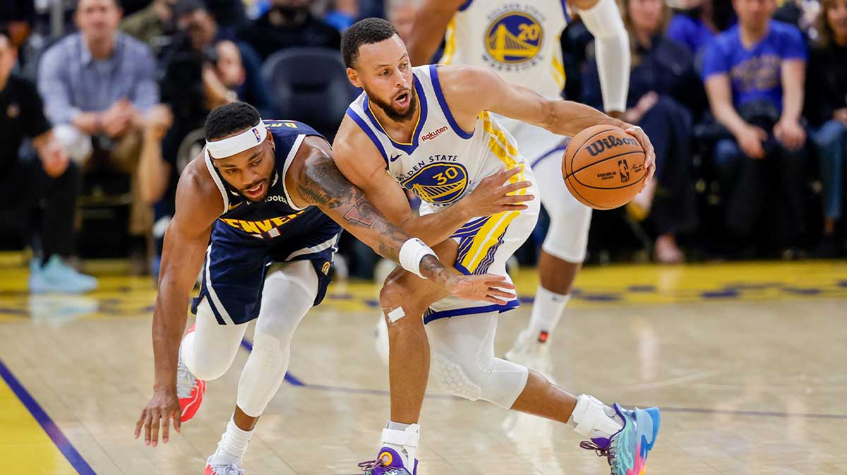 Golden State Warriors guard Stephen Curry (30) steals the ball from Denver Nuggets guard Bruce Brown (11) during the second quarter at Chase Center.