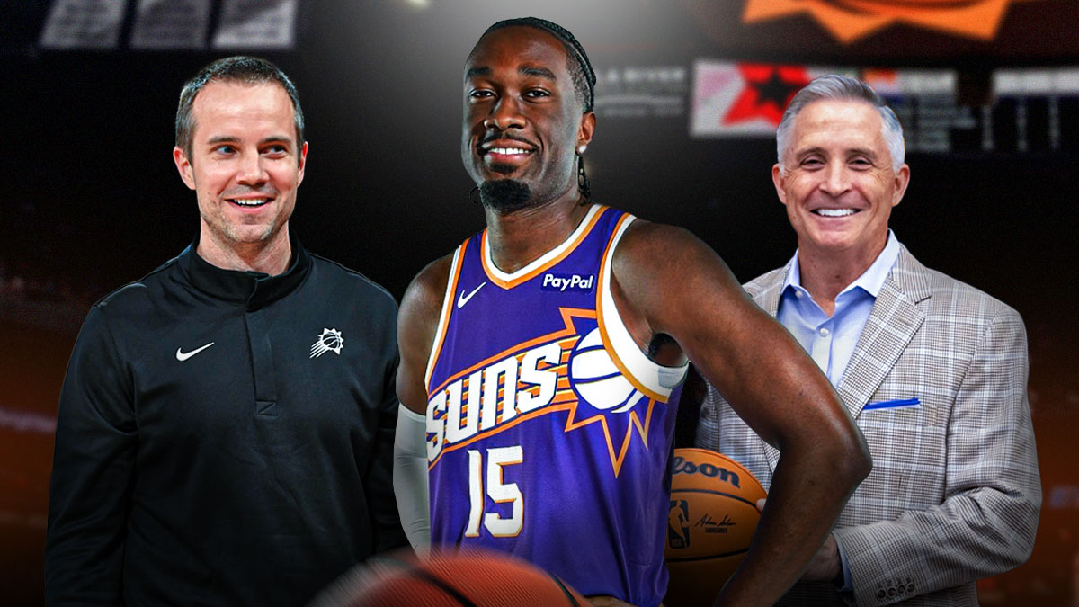 Mark Williams in a Phoenix Suns jersey screaming. There's also general manager Brian Gregory and head coach Jordan Ott smiling next to Williams.