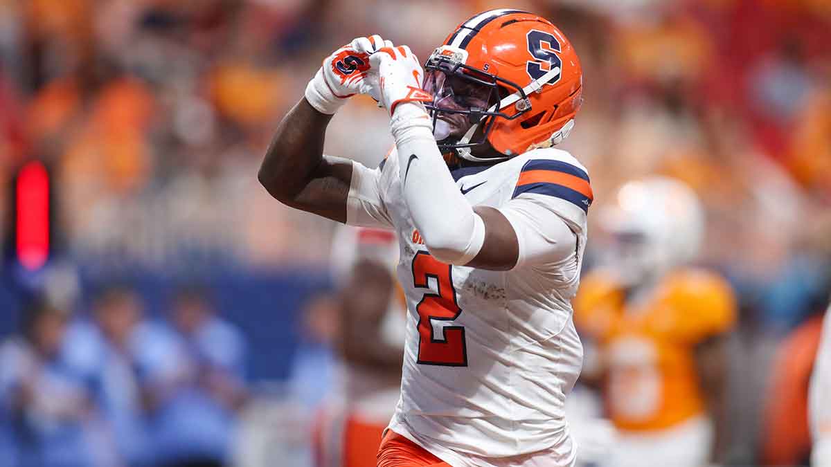 Syracuse Orange football wide receiver Johntay Cook (2) celebrates after a touchdown against the Tennessee Volunteers in the second quarter at Mercedes-Benz Stadium.