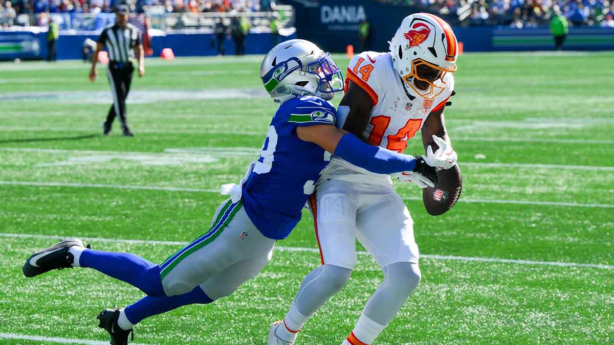 Seattle Seahawks safety Ty Okada (39) breaks up a pass to Tampa Bay Buccaneers wide receiver Chris Godwin Jr. (14) during the first half at Lumen Field.