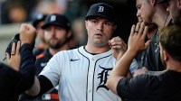 Detroit Tigers pitcher Tarik Skubal high-fives teammates in the dugout after a pitching change during the seventh inning at Comerica Park in Detroit on Wednesday, May 14, 2025.