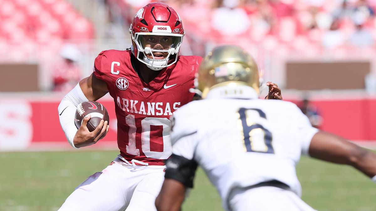 Arkansas Razorbacks quarterback Taylen Green (10) rushes during the fourth quarter against the Notre Dame Fighting Irish at Donald W. Reynolds Razorback Stadium. Notre Dame won 56-13. 