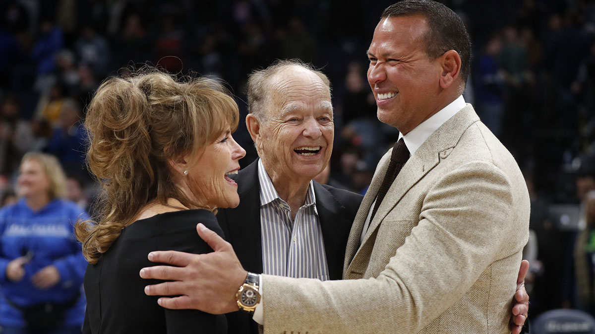 Current majority owner of the Minnesota Timberwolves Glen Taylor and his wife Becky Mulvihill greet minority owner Alex Rodriguez (right) after the team defeated the Golden State Warriors at Target Center.