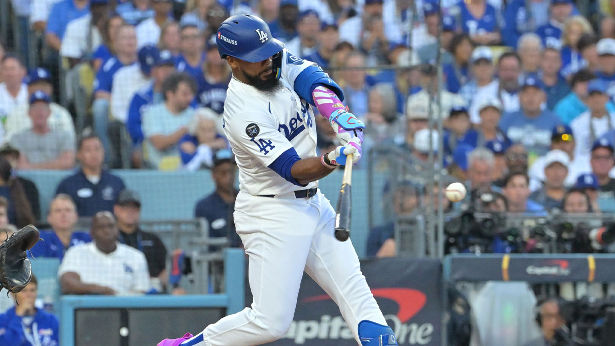 Los Angeles Dodgers right fielder Teoscar Hernandez (37) hits a solo home run against the Toronto Blue Jays in the second inning during game three of the 2025 MLB World Series at Dodger Stadium. Mandatory Credit: Jayne Kamin-Oncea-Imagn Images