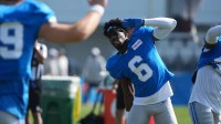 Detroit Lions CB Terrion Arnold stretches during practice at the Lions training facility in Allen Park, Thursday, Aug. 14 2025