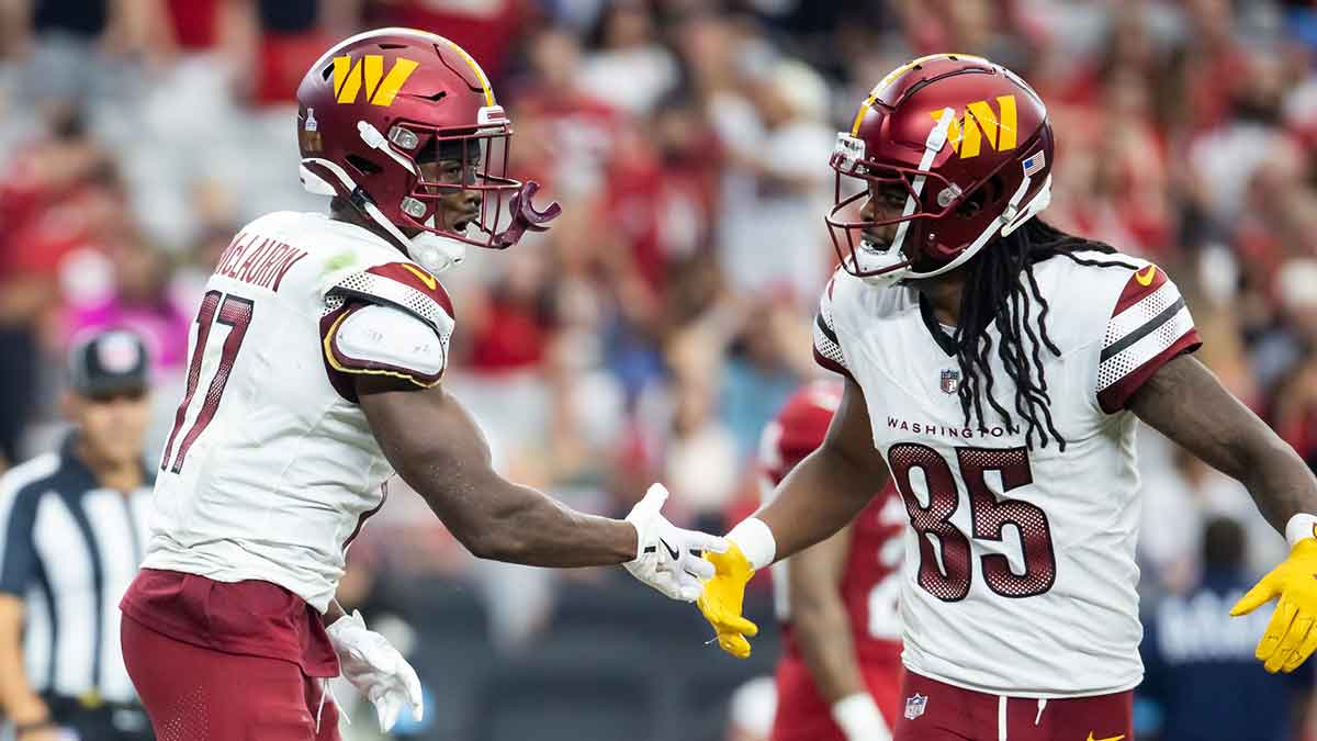 Washington Commanders wide receiver Terry McLaurin (17) celebrates a touchdown with Noah Brown (85) against the Arizona Cardinals in the second half at State Farm Stadium.