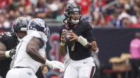 Houston Texans quarterback CJ. Stroud (7) looks for an open receiver during the fourth quarter against the Tennessee Titans at NRG Stadium.