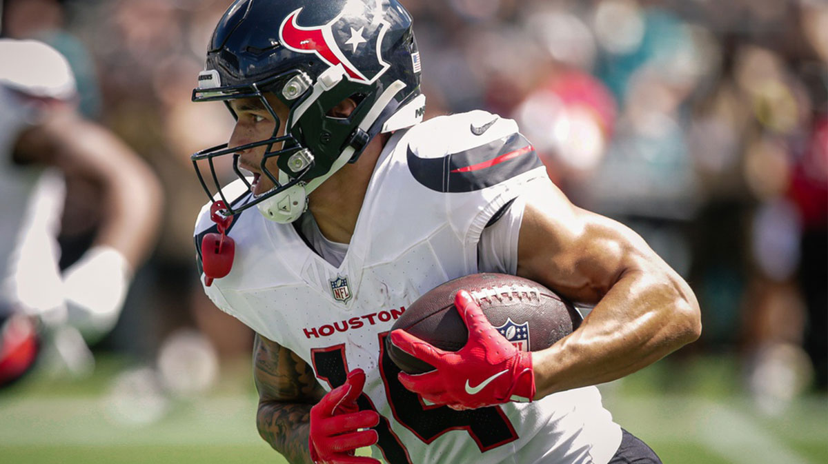Houston Texans wide receiver Jaylin Noel (14) runs with the ball against the Jacksonville Jaguars at EverBank Stadium.