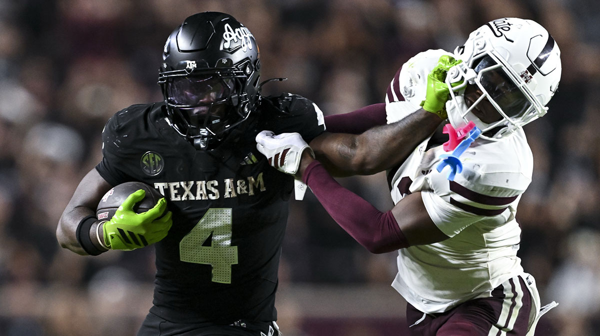 Texas A&M Aggies running back Rueben Owens II (4) stiff arms Mississippi State Bulldogs safety Jahron Manning (13) during the fourth quarter at Kyle Field.
