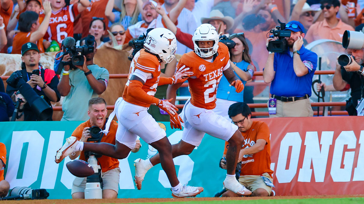 Texas Longhorns defensive back Ryan Niblett (21) reacts after returning a punt for a touchdown during the second half against the Oklahoma Sooners at the Cotton Bowl
