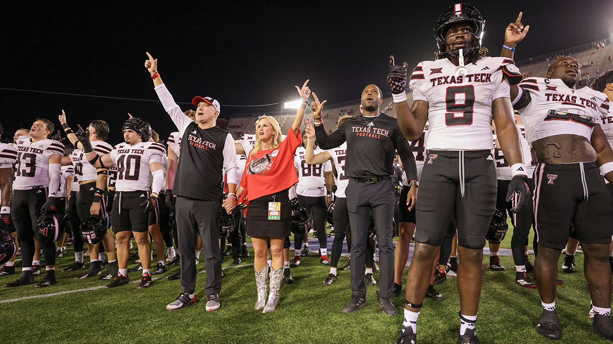 Texas Tech Raiders head coach Joey McGuire and his wife Debbie McGuire sing the school song with the teams players after they defeated the Houston Cougars at TDECU Stadium.
