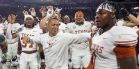 Texas Longhorns head coach Steve Sarkisian reacts with defensive linemen Colin Simmons (1) after beating the Mississippi State Bulldogs in overtime at Davis Wade Stadium at Scott Field.