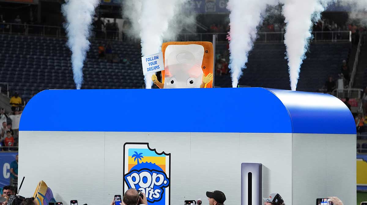 The Cinnamon Pop-Tart mascot goes into a toaster to be toasted after the Iowa State Cyclones defeatied the Miami Hurricanes at Camping World Stadium.