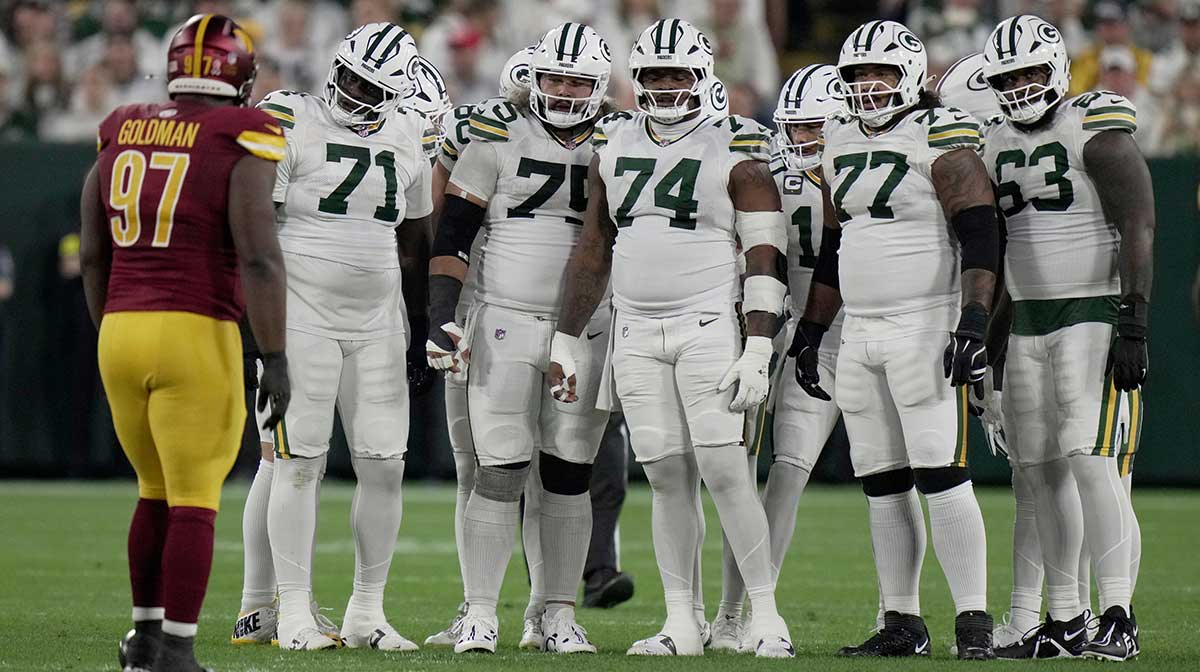 The Green Bay Packers offensive line is shown during the first quarter of their game against the Washington Commanders