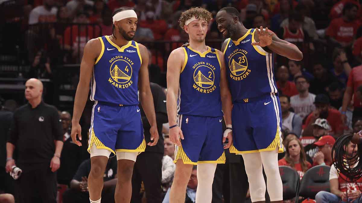 Golden State Warriors forward Draymond Green (23) talks to guard Brandin Podziemski (2) and guard Moses Moody (4) before playing against the Houston Rockets in the second quarter during game five of first round for the 2025 NBA Playoffs at Toyota Center.