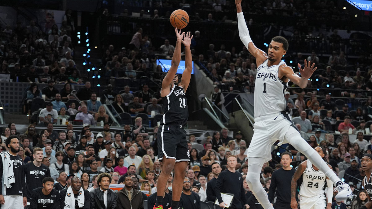 Brooklyn Nets guard Cam Thomas (24) shoots in front of San Antonio Spurs forward Victor Wembanyama (1) in the second half at Frost Bank Center.